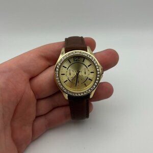 Vintage women’s gold face watch with browns adjustable band!